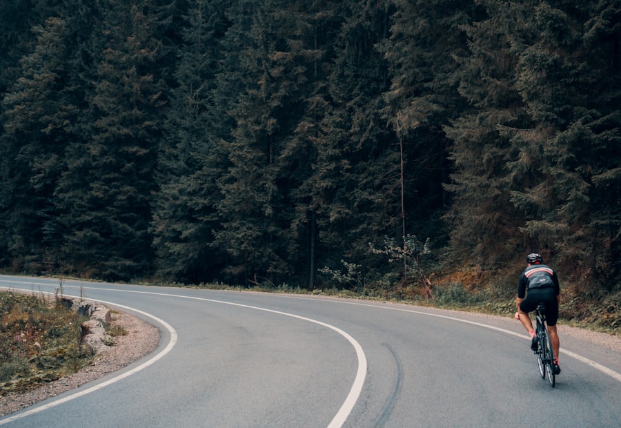 Road cyclist on a forest road